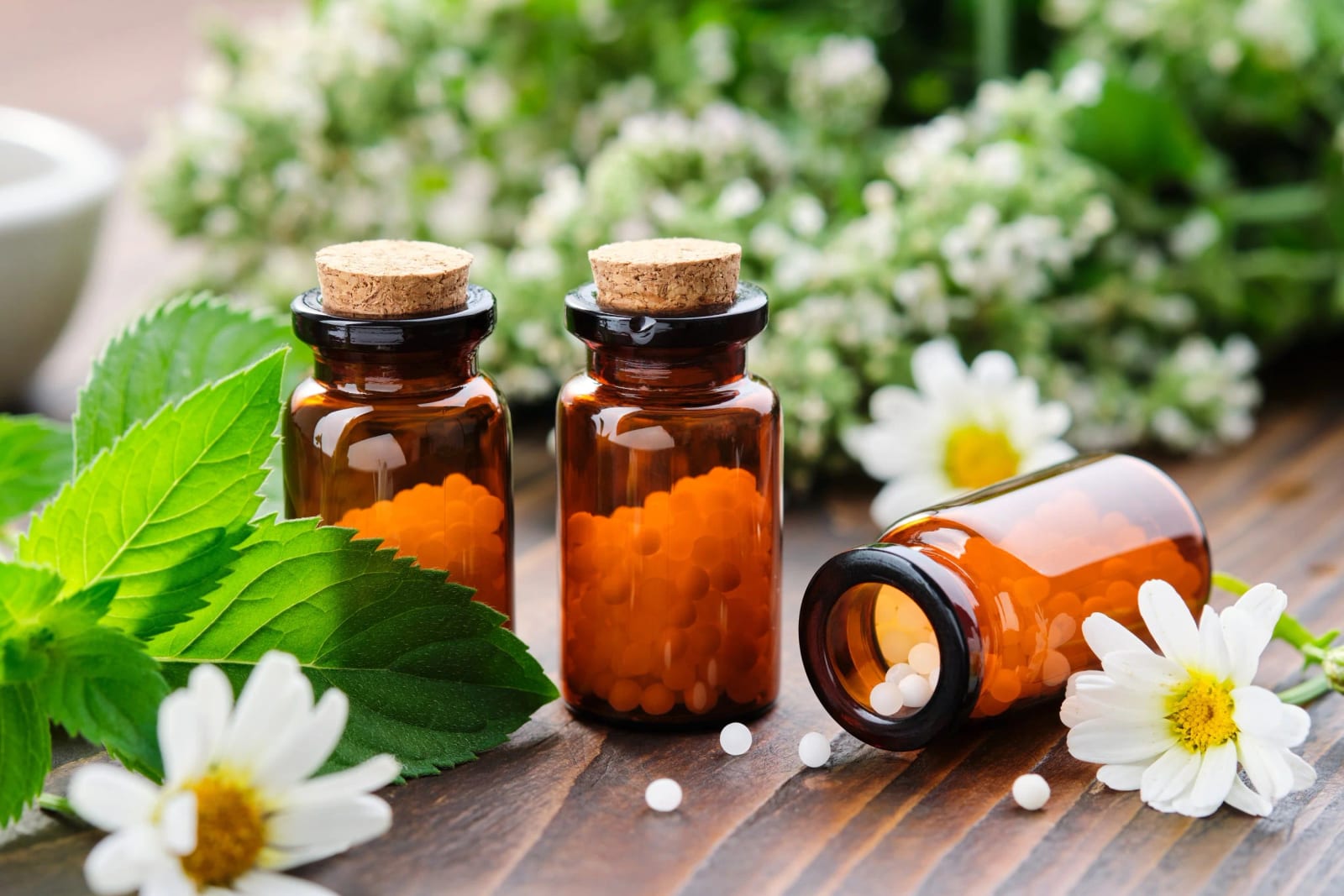 Remedy bottles among the flowers